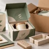 Custom product packaging with a fitted insert beside an outer corrugated shipping box
