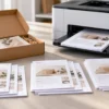 Collated multi-page product inserts arranged as complete sets beside a custom packaging box
